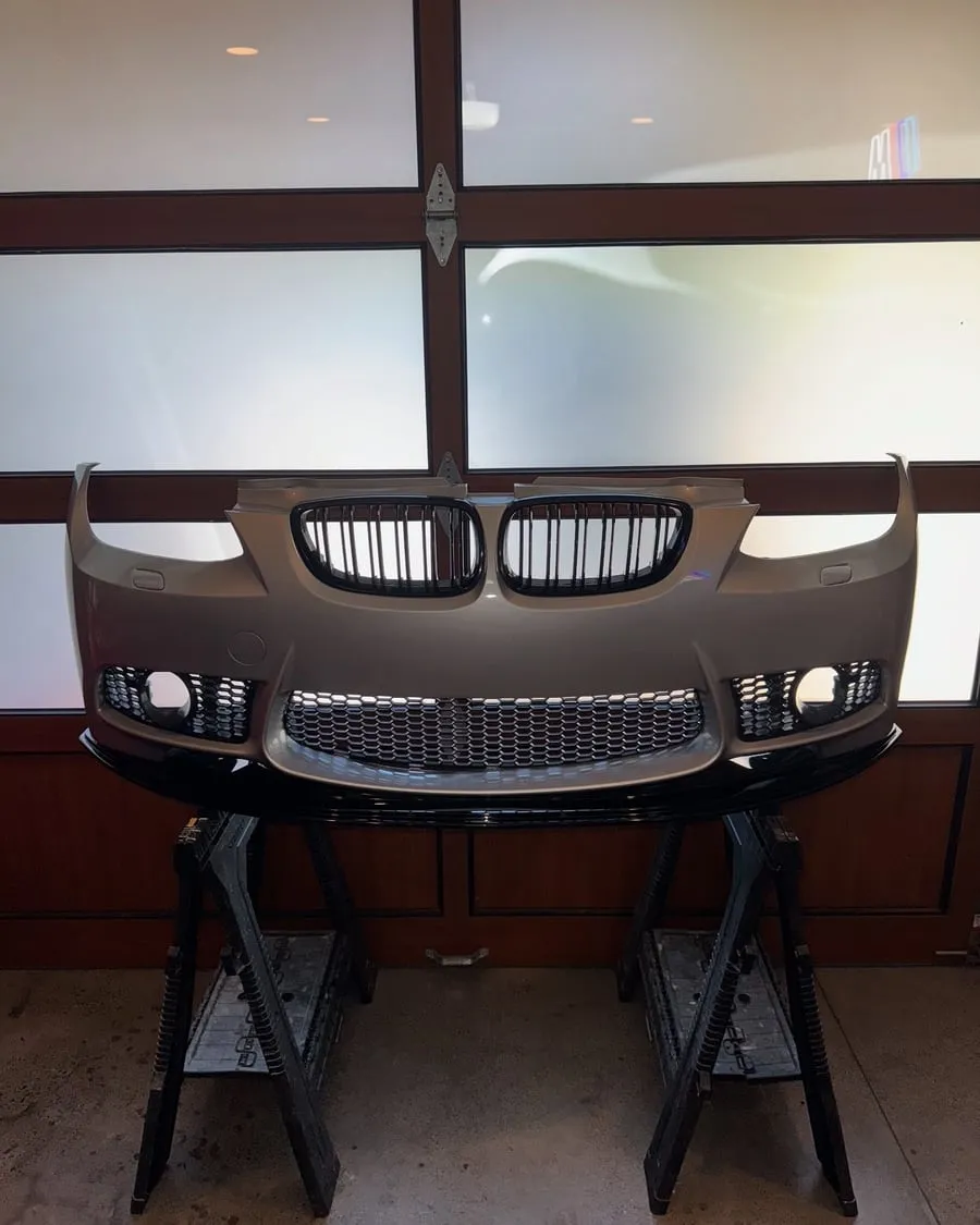 BMW E92 335i with an M-Tech front bumper and aftermarket gloss-black splitter installed at PDXEuroWerks in Portland, OR