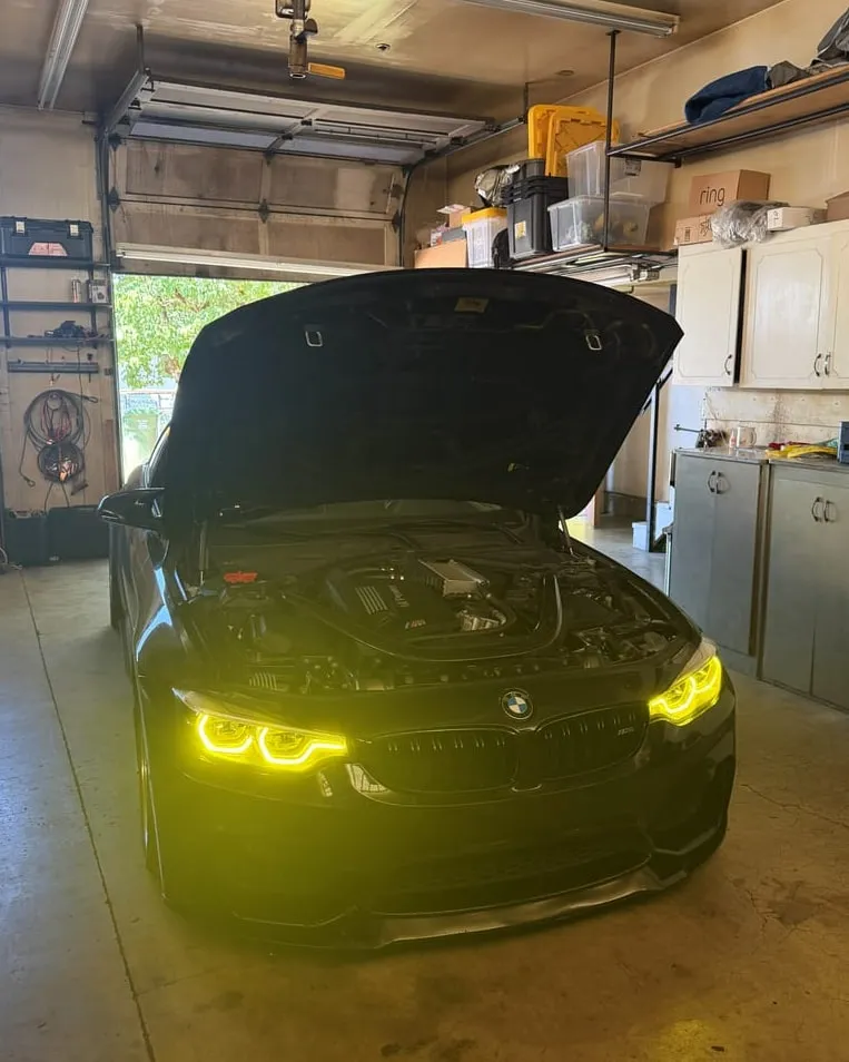 Black BMW F82 M4 after a catless downpipe install and tune flash at PDXEuroWerks, a Portland BMW performance shop