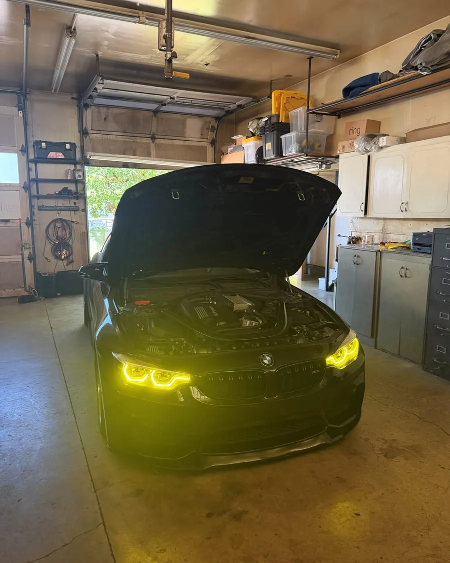 Black BMW F82 M4 after a catless downpipe install and tune flash at PDXEuroWerks, a Portland BMW performance shop