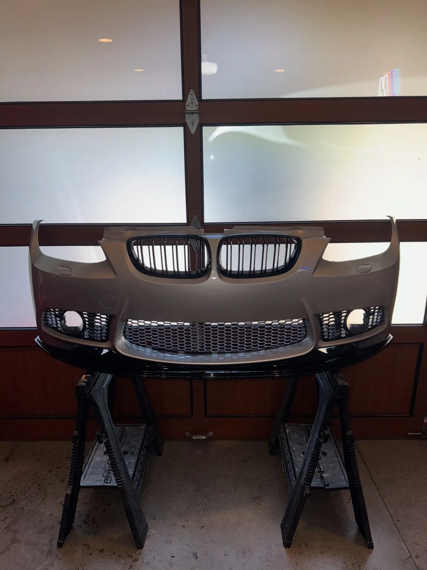 BMW E92 M-Tech front bumper with a gloss-black lip and kidney grilles for a carbon fiber cosmetic install at PDXEuroWerks in Portland, Oregon
